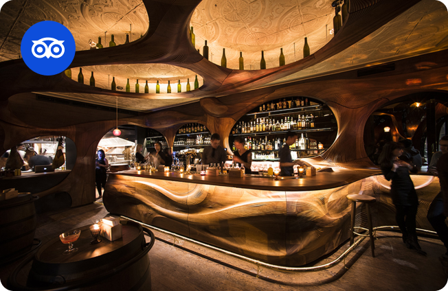 Bar Raval interior with carved wood design and cozy atmosphere